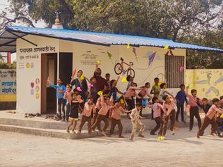 Kids outside of an Anganwadis (public day care center) designed by Social Design Collaborative