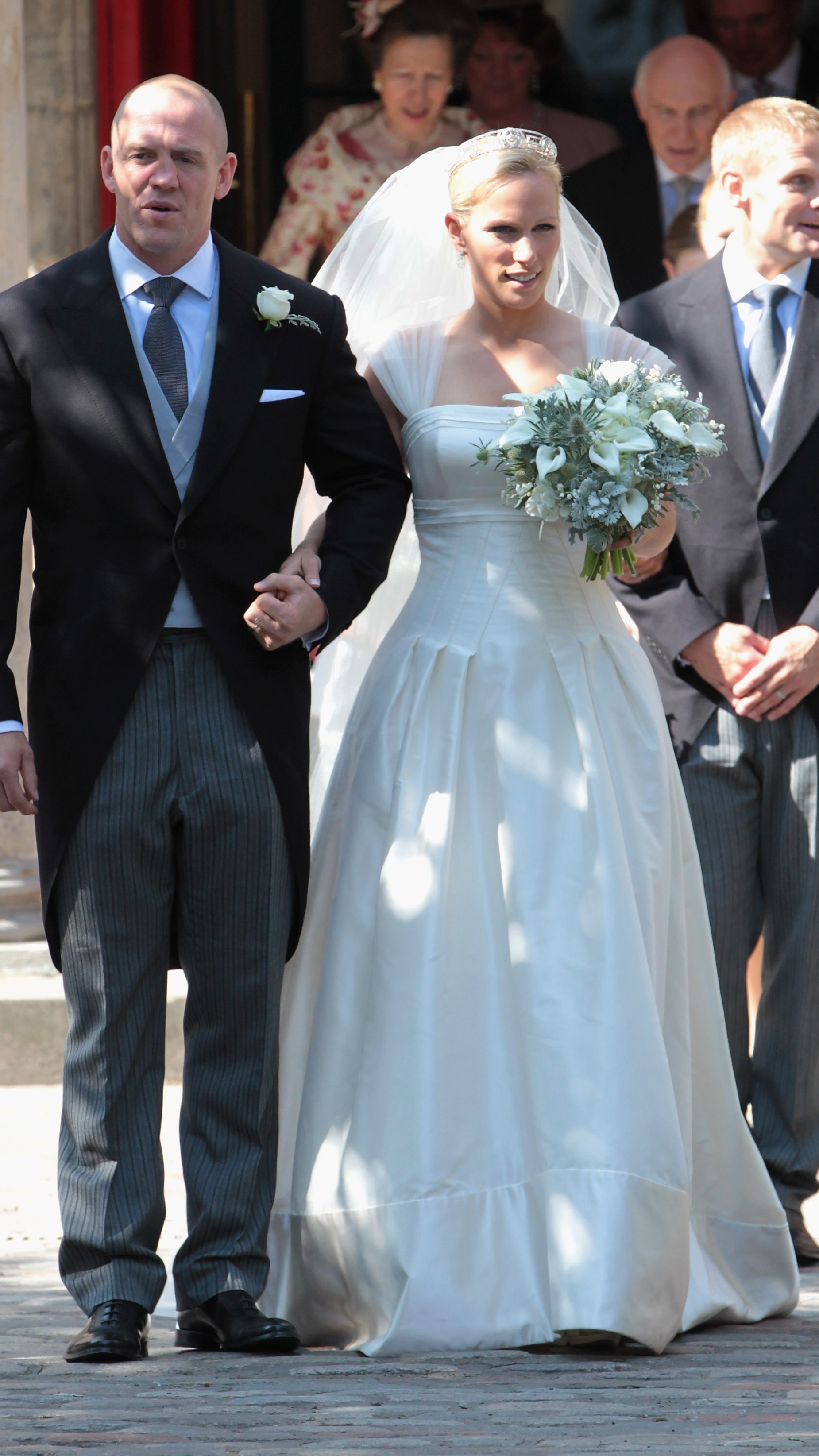 Zara and Mike Tindall leave, arm in arm, after their wedding at Canongate Kirk, in Edinburgh on July 30, 2011