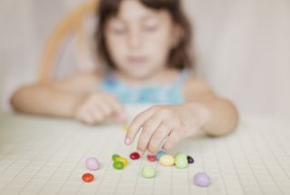 A child with jelly beans