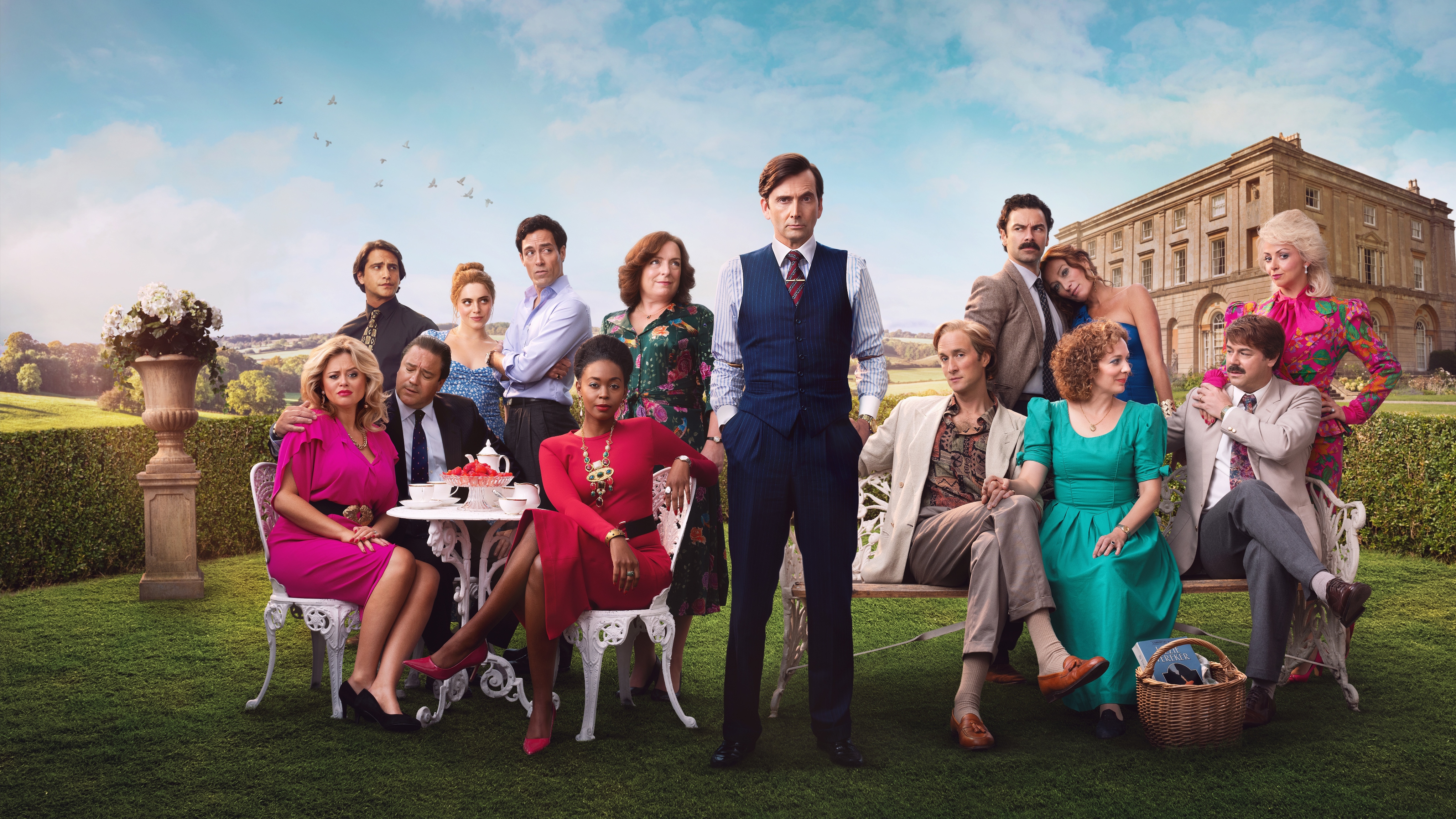 Rivals cast promo shot for season 2 with everyone sitting in a garden looking at one another or the camera 