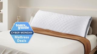 The image shows the Oubonun Quilted Body Pillow on a white bed with a Cyber Monday badge on top