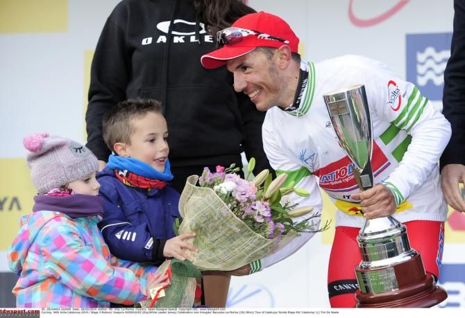 Joaquim Rodriguez (Katusha) takes the flower
