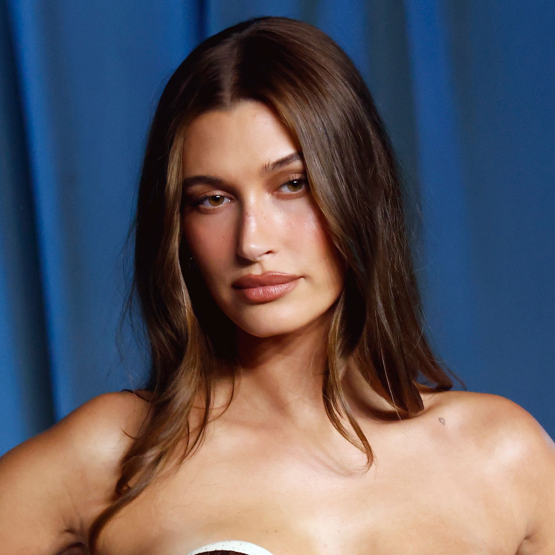Hailey Bieber attends the 2025 Academy Museum Gala at Academy Museum of Motion Pictures with chocolate brown hair
