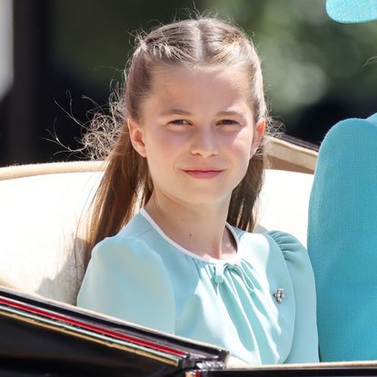 Princess Charlotte wears a light turquoise dress with a silver brooch