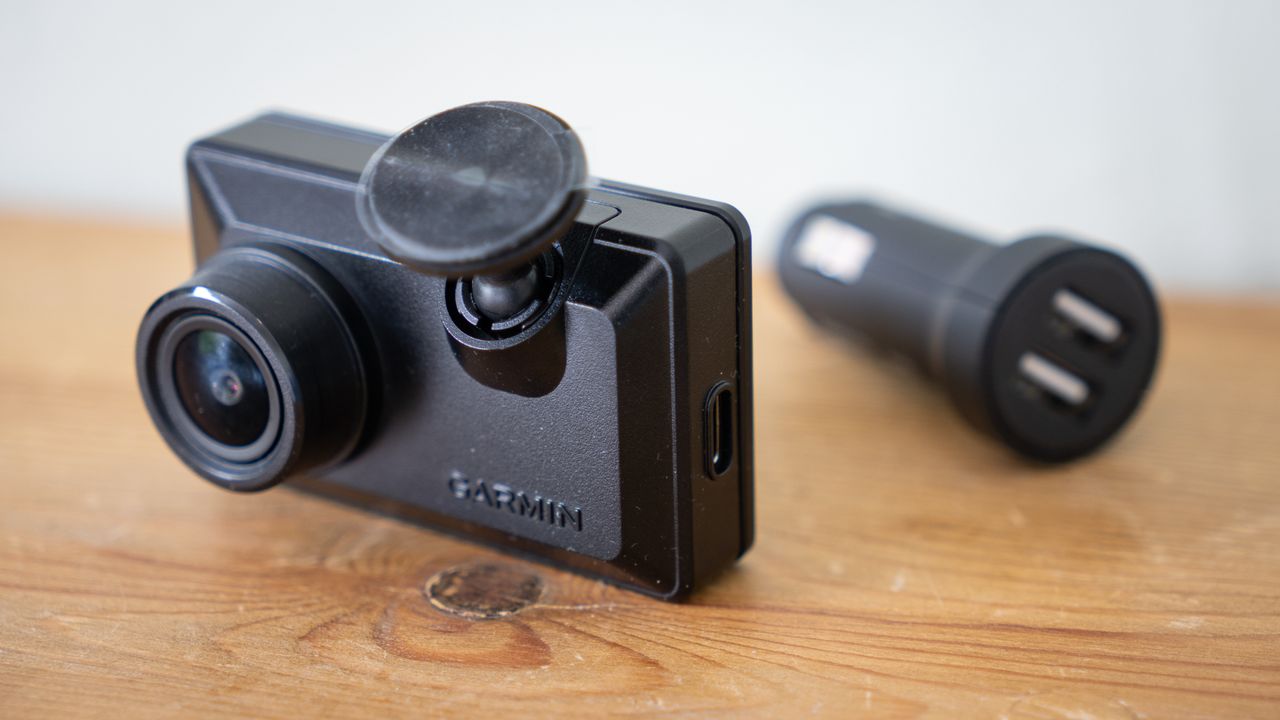Garmin Dash Cam X110 on a wooden table