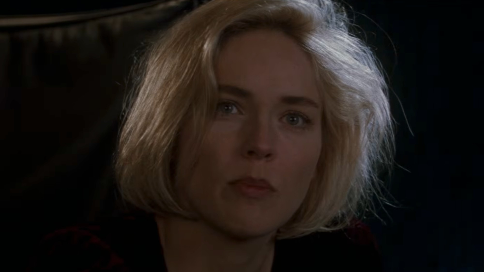 A close up of Sharon Stone looking serious in Sliver