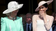 Meghan Markle and Queen Camilla attend The Prince of Wales' 70th Birthday Patronage Celebration held at Buckingham Palace on May 22, 2018 in London
