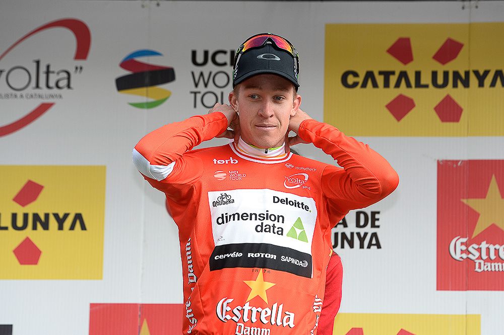 Cameron Meyer in red on the stage 1 podium at Volta a Catalunya.