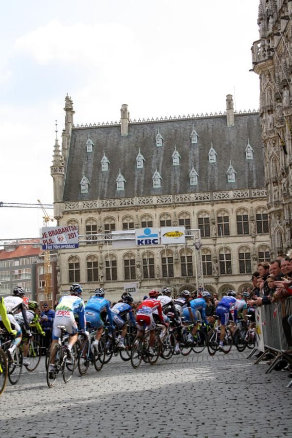 The riders leave the spectacular square in Leuven