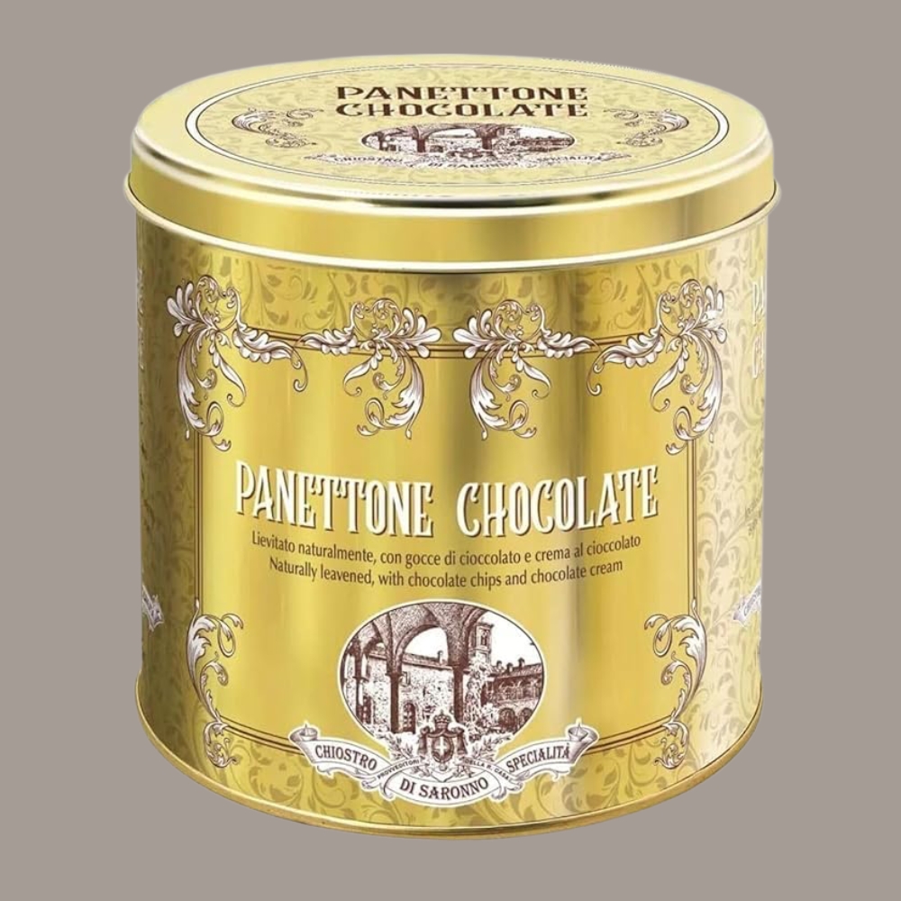 Chiostro di Saronno Panettone in golden tin against a pale brown background.
