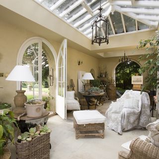 living room armchair with potted plants