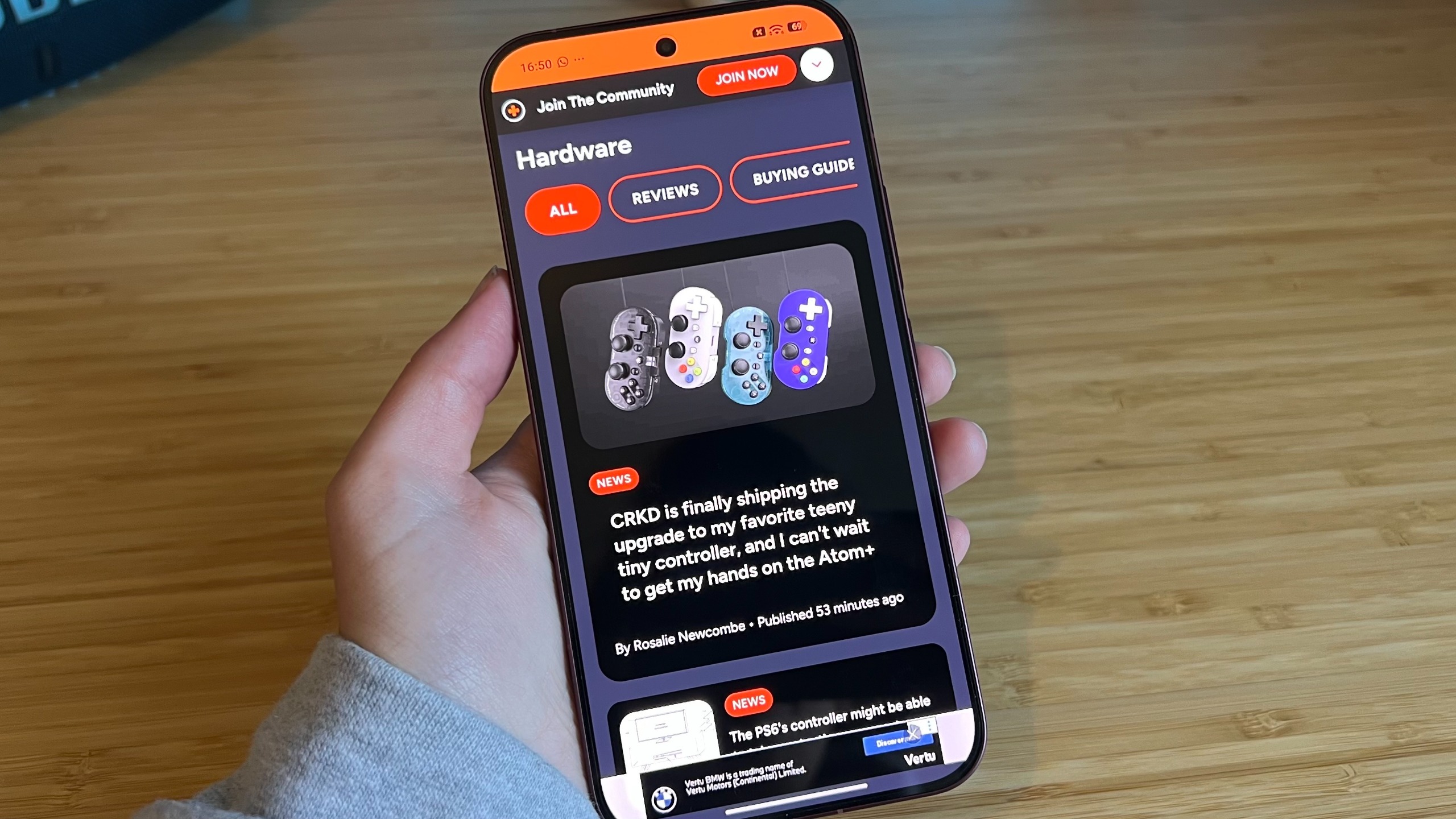 Poco F9 Ultra showing GamesRadar+ homepage on its display while being held in the hand