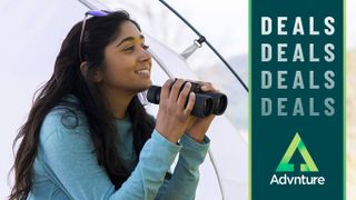 Woman sitting in a tent with the Nikon Prostaff P3 10x42 binoculars 