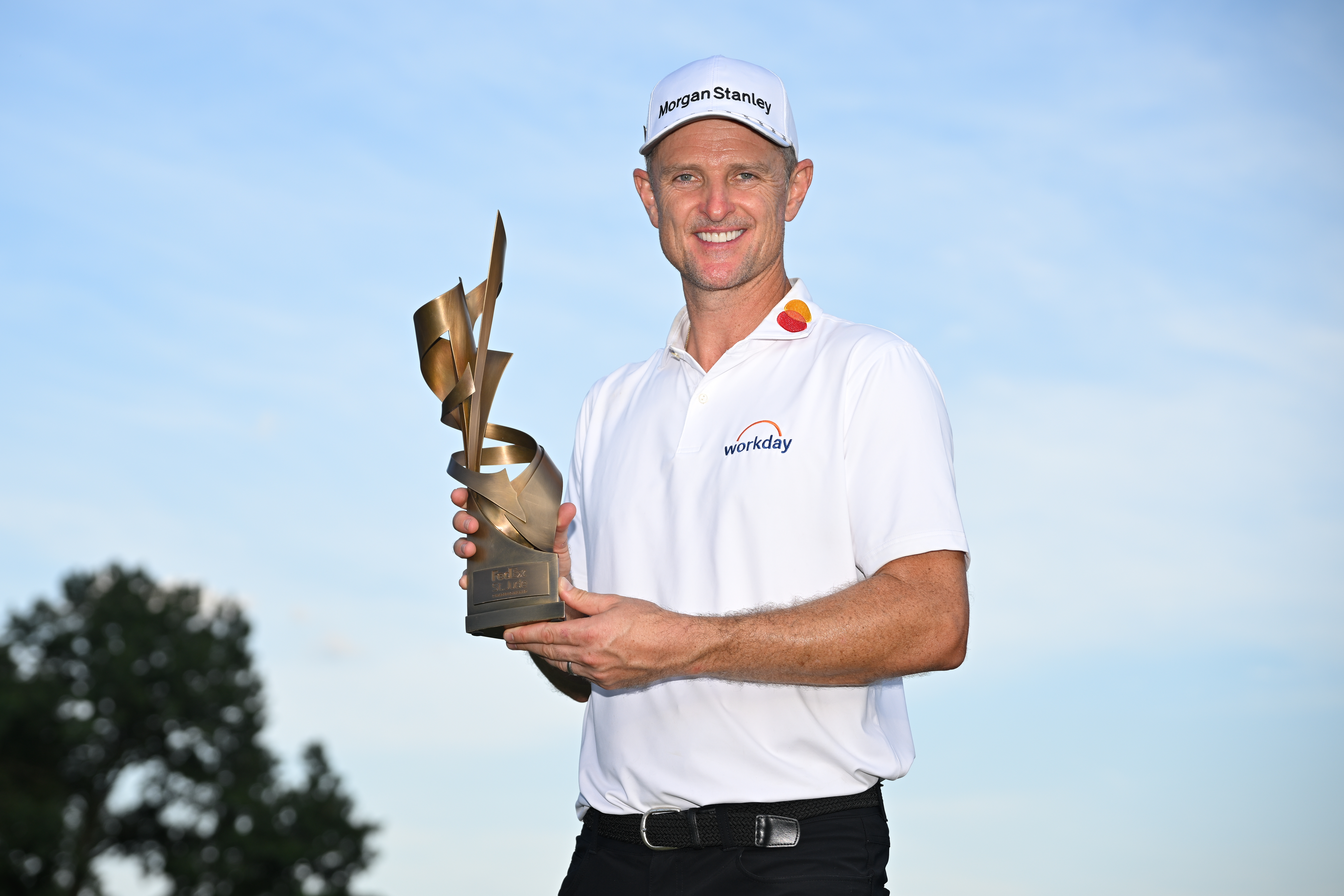 Justin Rose poses with the FedEx St Jude Championship trophy
