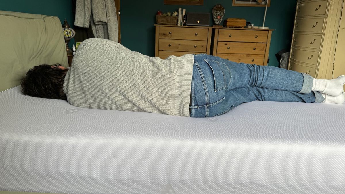 Tester side sleeping on the ErgoFlex 5G mattress