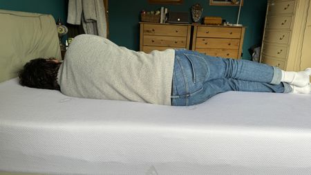Tester side sleeping on the ErgoFlex 5G mattress