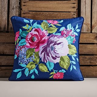 blue cushion in square shape with floral design