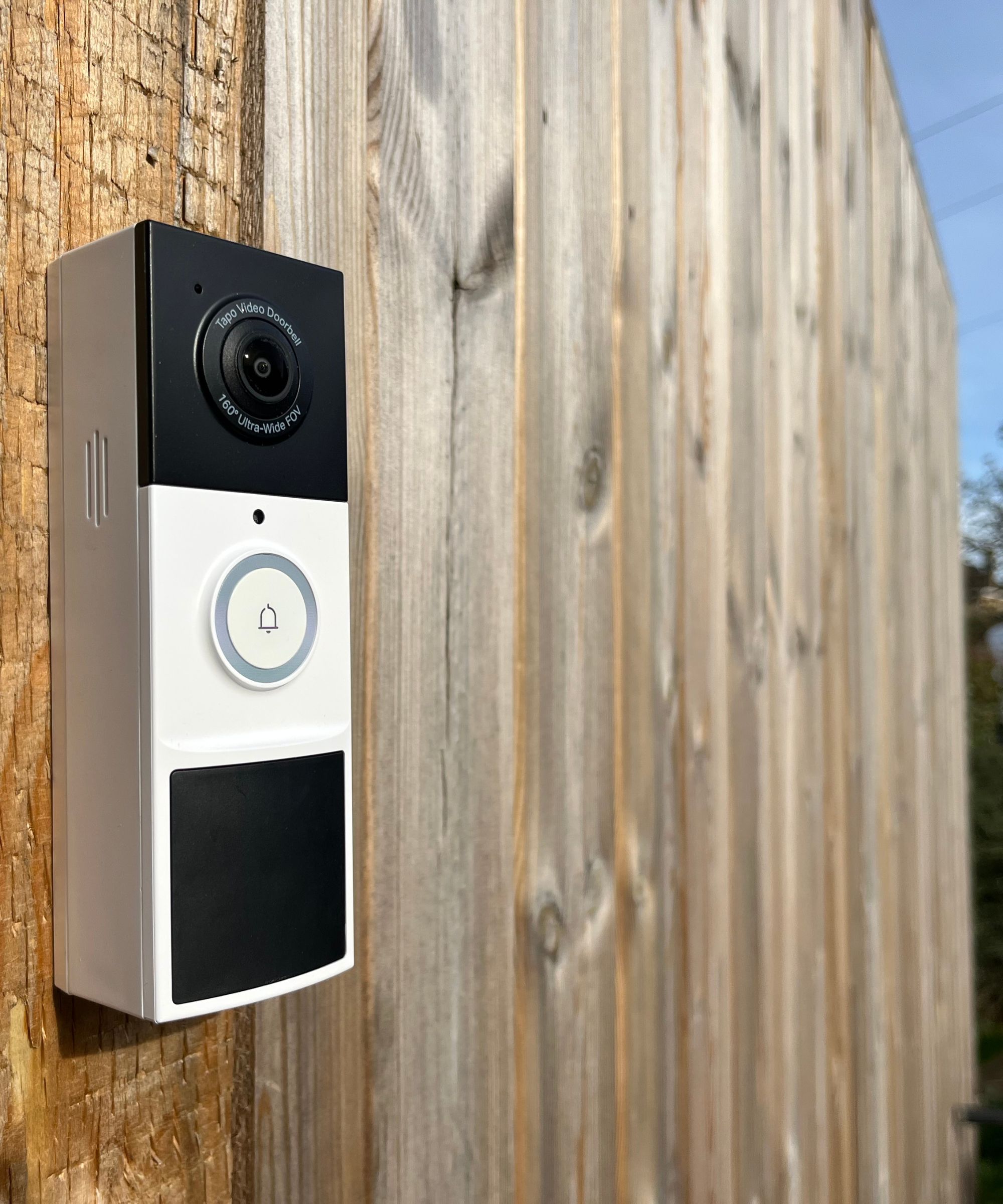 Tapo D210 Video Doorbell secured to fence panel
