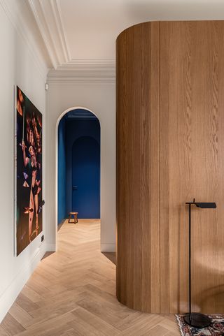 bedroom with blue door and curved walls