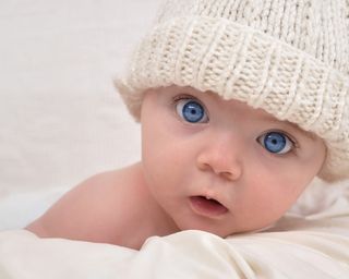 cute newborn baby boy with blue eyes