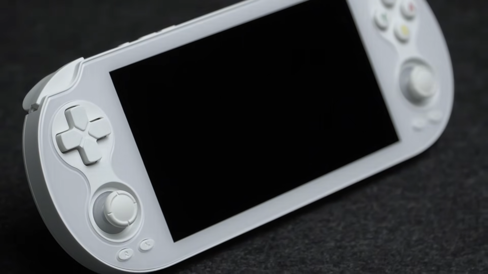 Close up of white Anbernic RG Vita at an angle.