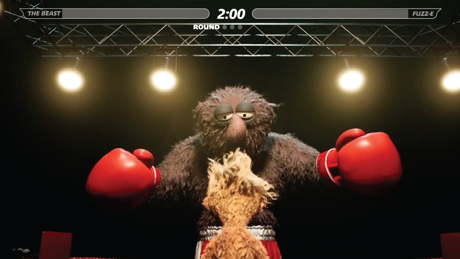 Felt That: Boxing screenshot of a big puppet with large boxing gloves called The Beast going up against smaller protagonist puppet Fuzz-E in this ring, The Beast looks imposing and has his arms raised