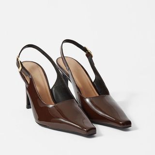 Flat lay image of brown heel pumps