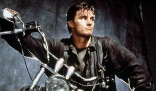 The Punisher Dolph Lundgren scowling on a motorcycle