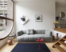 The Quilton sofa by Doshi Levien for Hay in gray, photographed at the Barbican inside the designers' flat
