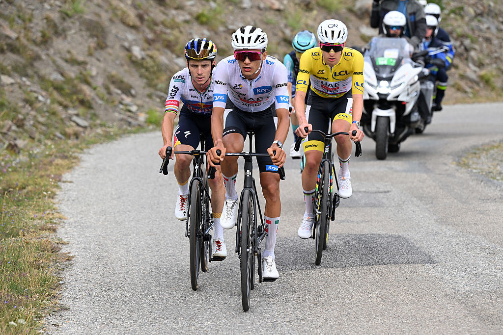ALPE D&amp;amp;apos;HUEZ, FRANCE - JULY 25: (L-R) Remco Evenepoel of Belgium and Team Red Bull - BORA - hansgrohe, Isaac Del Toro of Mexico - White best Young Rider Jersey and Tadej Pogacar of Slovenia and UAE Team Emirates - XRG - Yellow Leader Jersey compete in the chase group during the 113th Tour de France 2026, Stage 20 a 170.9km stage from Le Bourg d&amp;amp;apos;Oisans to Alpe d&amp;amp;apos;Huez 1842m / #UCIWT / on July 25, 2026 in Alpe d&amp;amp;apos;Huez, France. (Photo by Dario Belingheri/Getty Images)