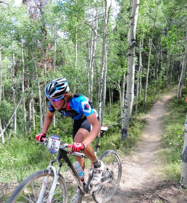 Sam Schultz (Gary Fisher/Subaru) exits the woods.