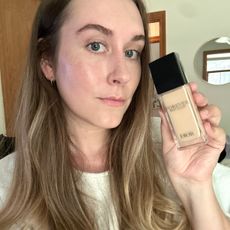 Beauty editor Kaitlyn McLintock holding a Dior foundation