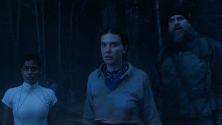 Millie Bobby Brown as Eleven, David Harbour as Hopper and Linnea Berthelsen as Kali in Stranger Things season 5 volume 2