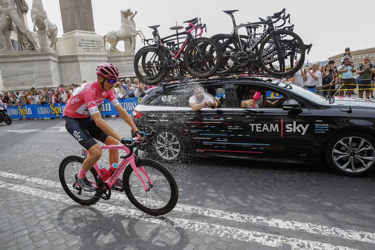Chris Froome gets a spumante shower on the final stage in Rome