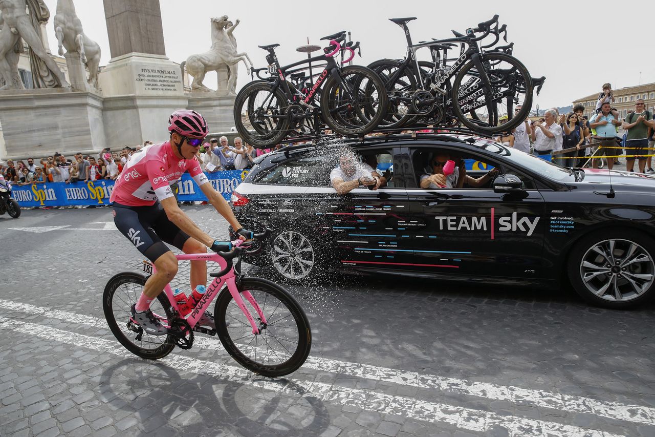 Chris Froome gets a spumante shower on the final stage in Rome