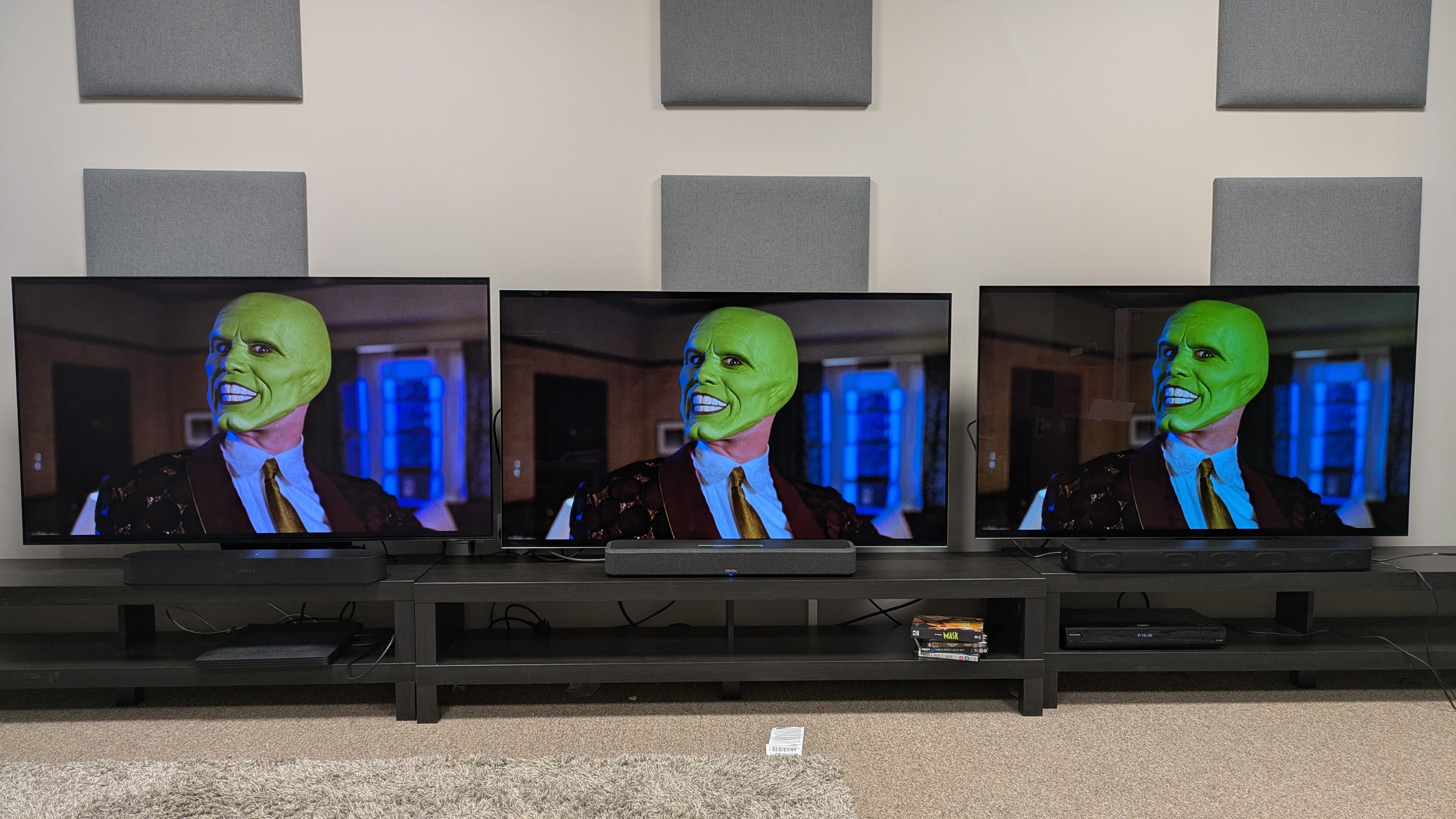 Sonos Beam (Gen 2) (left) under Samsung S95F , Denon Home 550 (middle) under LG G5 and Sony HT-S2000 (right) under LG C5, all showing The Mask