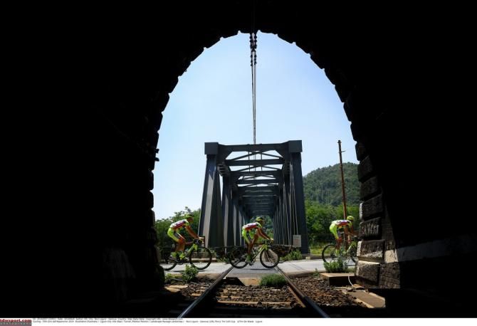Riders passing a railway tunnell