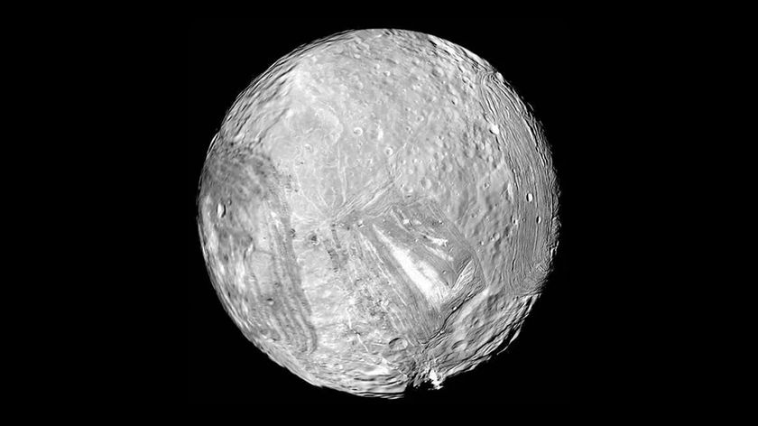 A black and white image of an icy moon