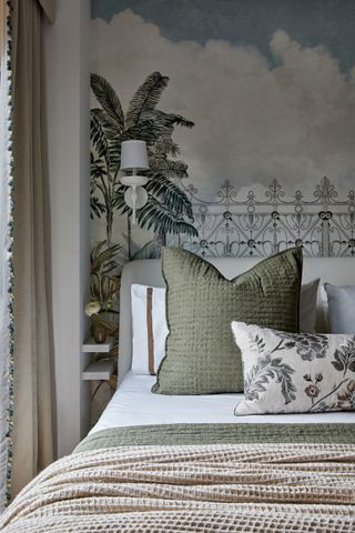 green and blue bedroom with botanical themed wallpaper