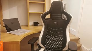 Epic Series real leather chair from Noblechairs mid-length shot in front of desk