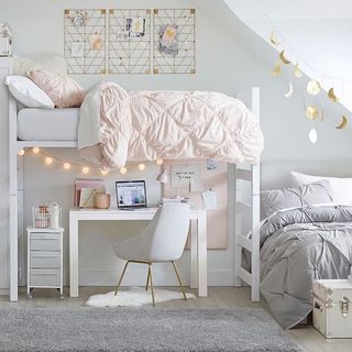 Light bedroom with loft bed and desk
