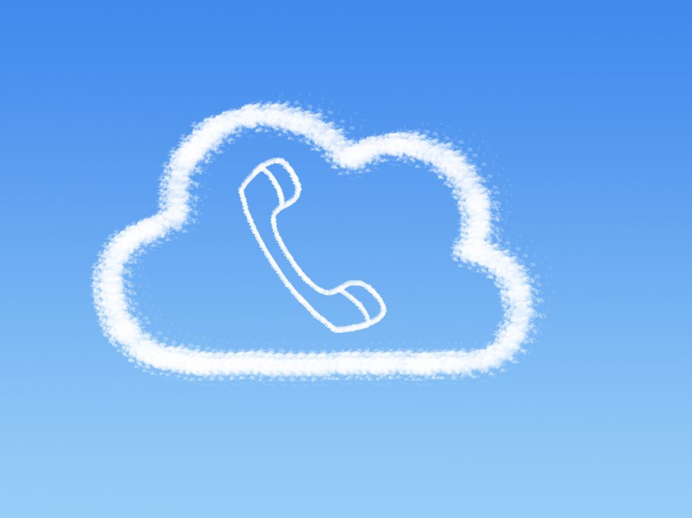 A cartoon phone handset surrounded by the outline of a cloud