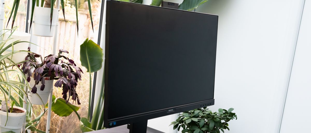 A black Philips 276B9H monitor sitting on a desk