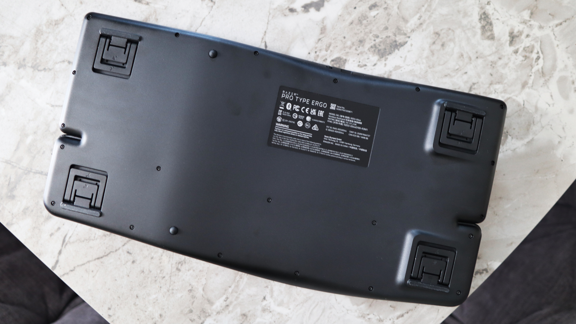 Razer Pro Type Ergo ergonomic keyboard on marble surface