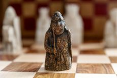 LONDON, ENGLAND – JUNE 3: A newly discovered Lewis Chessman at Sotheby’s on June 3, 2019 in London, England. On 2 July in London, Sotheby’s will offer the first discovery of an unknown missing piece from the hoard of 93 objects found in 1831 on the Isle of Lewis in the Outer Hebrides. Made in the late 12th/early 13th century, and most likely Norwegian in origin, the Lewis Chessmen were probably the stock of a trader in chessmen that never reached their market, who buried them after a shipwreck. Acquired for £5 in 1964 by an antiques dealer in Edinburgh, the Lewis Warder will be presented with an estimate of £600,000-1,000,000 in Sotheby’s sale of Old Master Sculpture & Works of Art. The Lewis Chessmen are regarded as the most famous chess pieces to have survived from the medieval world. (Photo by Tristan Fewings/Getty Images for Sotheby's)