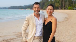 Fred Sirieix and Emma Willis standing on the beach in Thailand