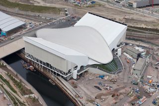 View of the Aquatics Centre, with the Polo Arena being developed behind