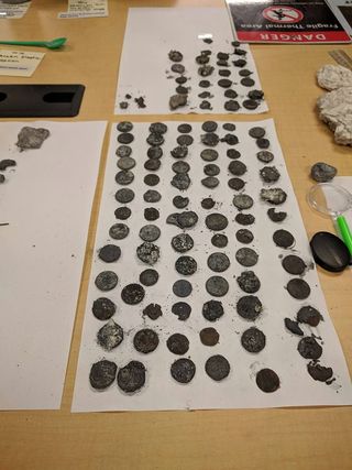 The garbage geyser ejected nearly 100 metal coins during the Sept. 15 eruption. Some of them were rusted, scorched and crumbled to bits inside the geyser's steamy gut.