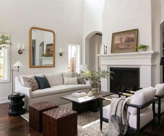 Cream living room with rustic style, cream sofas and a dark wooden coffee table