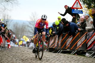 OUDENAARDE BELGIUM APRIL 02 Lotte Kopecky of Belgium and Team SD Worx competes passing through a cobblestones sector during the 20th Ronde van Vlaanderen Tour des Flandres 2023 Womens Elite a 1566km one day race from Oudenaarde to Oudenaarde UCIWWT on April 02 2023 in Oudenaarde Belgium Photo by Luc ClaessenGetty Images